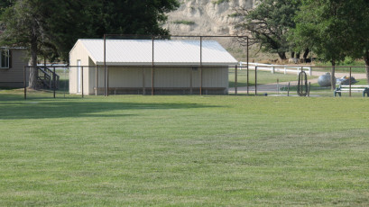 Backstop and recreation shed